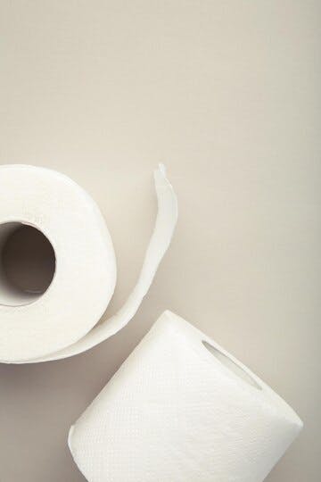 roll-toilet-paper-grey-background