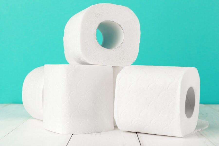 toilet-paper-rolls-turquoise-bright-background