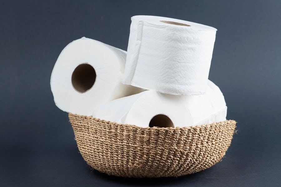 stack-toilet-paper-rolls-wicker-basket